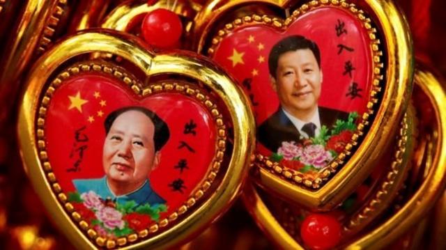Some say Mr Xi (right) is building a personal cult like Mao Zedong.
