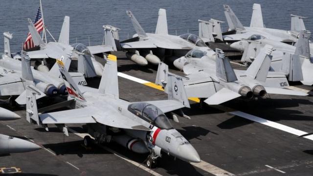 F-18 Hornet fighter jets are seen on the flight deck of the US aircraft carrier "USS Carl Vinson" at the Manila Bay, Philippines, 17 February 2018