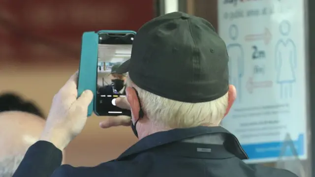 Mr Becker appears to record himself on his mobile phone at Southwark Crown Court