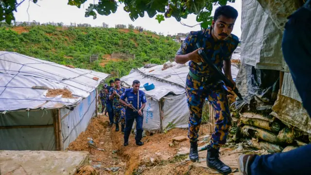 Bangladeshi police on patrol inside a refugee camp