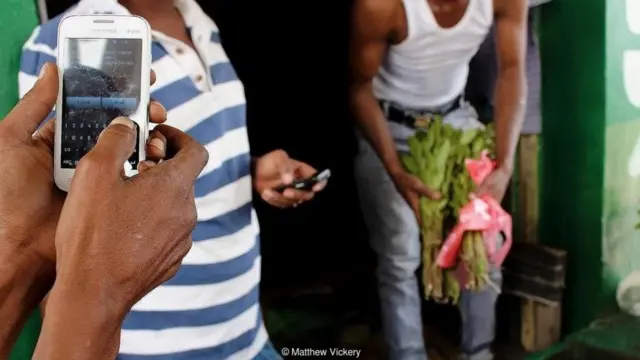 Persons in Somaliland buying products and services using mobile banking