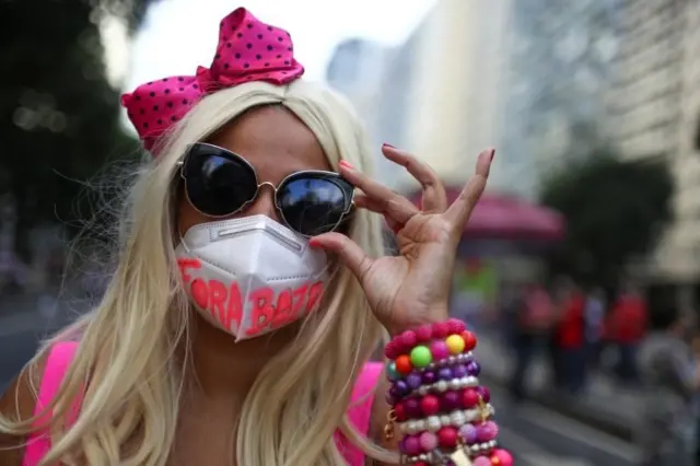 A woman takes part in a protest calling for the impeachment of Brazil"s President Jair Bolsonaro and against his handling of the coronavirus disease (COVID-19) pandemic, in Rio de Janeiro, Brazil, July 3, 2021