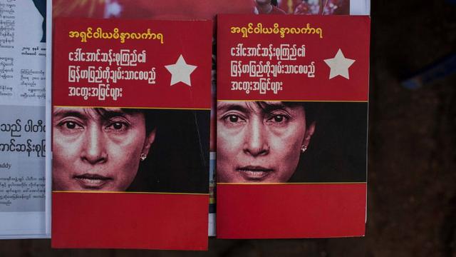 Booklets bearing Aung San Suu Kyi's face in Myanmar afterher party swept to victory in November 2015's election
