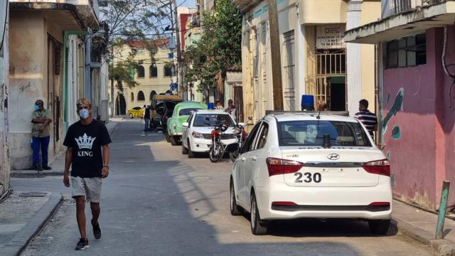 Two police cars are seen near the house of Luis Manuel Otero Alcantara, in the San Isidro neighbourhood of Havana, Cuba on 30 April