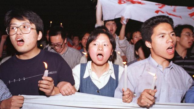 Chinese protestors march to the U.S. Embassy in Beijing May 9, 1999. Protests have erupted in a dozen or so major Chinese cities, drawing tens of thousands of angry citizens onto the streets. State media has fanned the fury by saying that the NATO bombing of the Chinese Embassy in Belgrade was a deliberate act of aggression