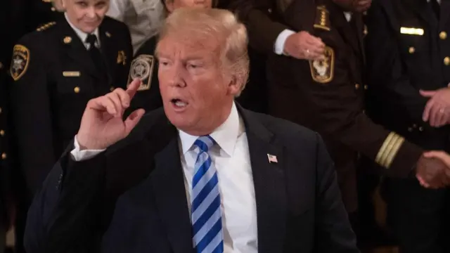 US President Donald Trump responds to a journalist at the White House