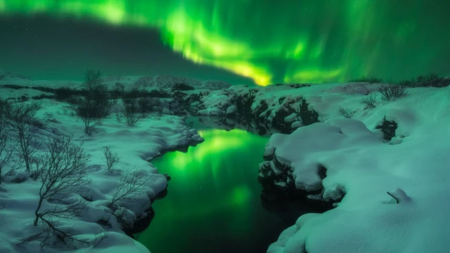 The Aurora reflected on the water.