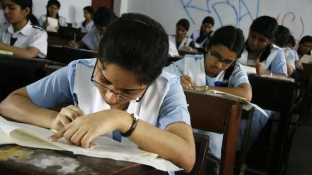 পরীক্ষা দিচ্ছেন কয়েকজন শিক্ষার্থী।