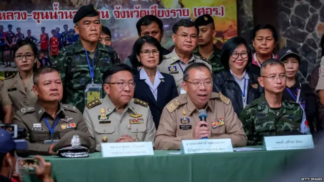 Chiang Rai Governor Narongsak Osot-tanakorn, who heads the rescue operation, talk to the press at the Khun Nam Nang Non Forest Park