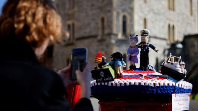 Knitted post box toppers featuring Queen Elizabeth II and Prince Philip, Duke of Edinburgh are pictured in Windsor, west of London, on April 17, 2021