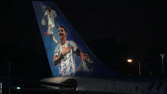 A picture of Lionel Messi on the tail of a plane
