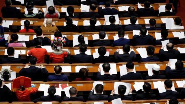 Delegates attend the fourth plenary session of the National People"s Congress (NPC) at the Great Hall of the People in Beijing, China March 13, 2018. REUTERS/Jason Lee