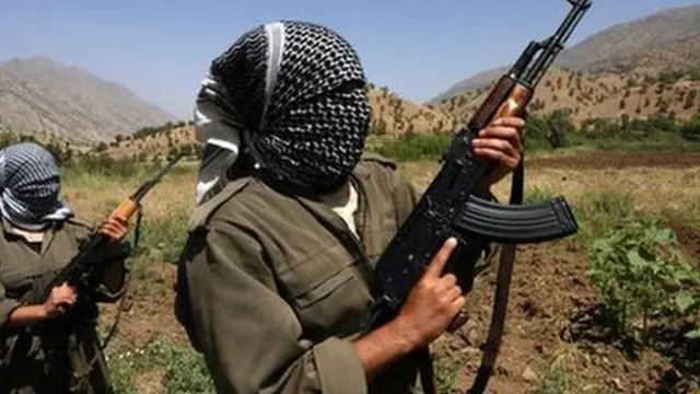 A picture taken in June 2007 of PKK fighters patrolling an area in the Iraqi part of the Qandil mountains near their headquarters on the Iraqi-Iranian-Turkish borders