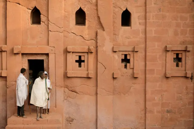 Ethiopian Orthodox pilgrims leave after attending a morning prayer session at the Bete Amanuel, "House of Emmanuel" monolithic orthodox church, ahead of Ethiopian Christmas in Lalibela, Ethiopia January 6, 2018.