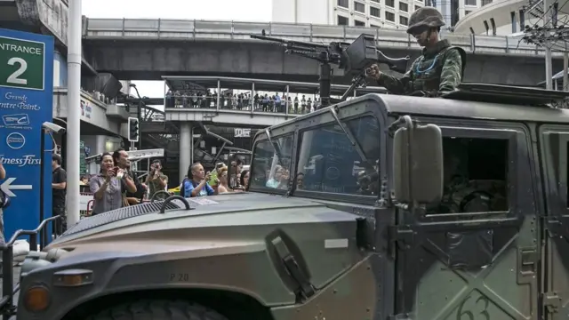 Thai military secure an area outside a shopping mall preventing anti-coup demonstrators from gathering on June 1, 2014 in Bangkok