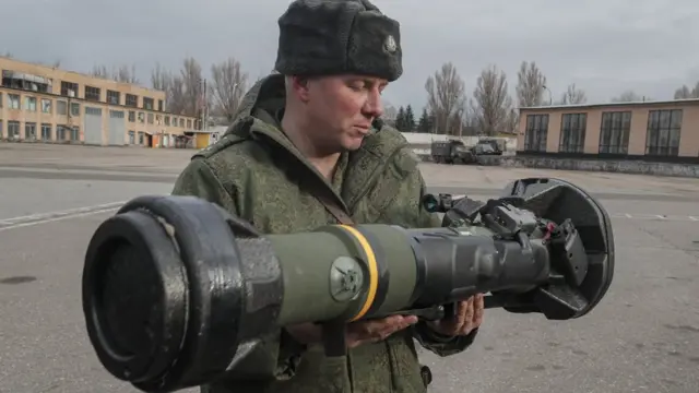 A serviceman of the Luhansk People"s Republic holds a NLAW Swidish-UK made Light Anti-tank weapon