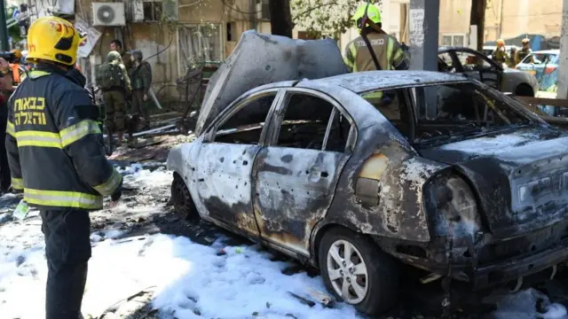 Police and rescue teams at the scene of a direct rocket hit in Ramat Gan, Israel, May 15, 2021