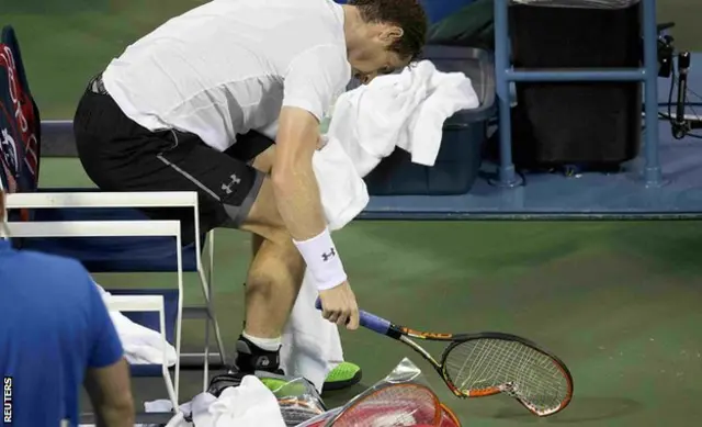 Andy Murray smashes his racquet