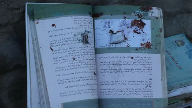 Aftermath of the attack shows blood stained books