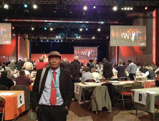 Charan Disthaapichai attends the Communist Party of France Congress in 2019