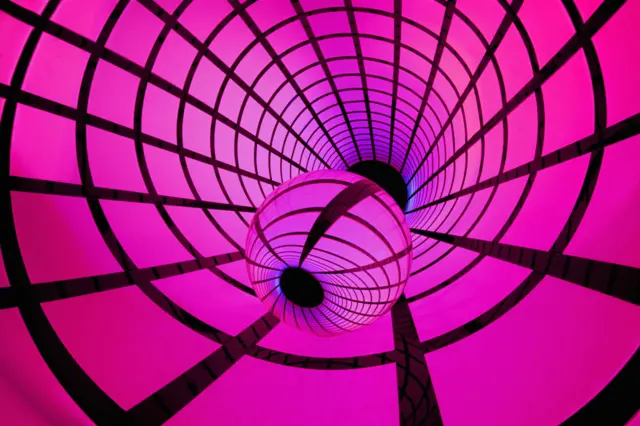 A spherical lens surrounded by a grid pattern