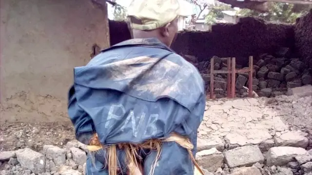 Nsabimana Desire arongoye Village 2 ya komine Gihanga yari yambaye ikoti irinda imvura y'igipolisi