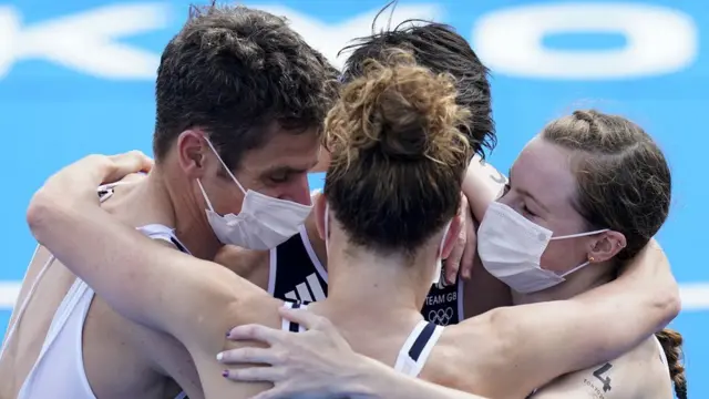 Great Britain celebrate winning the inaugural triathlon mixed relay event at an Olympic Games.