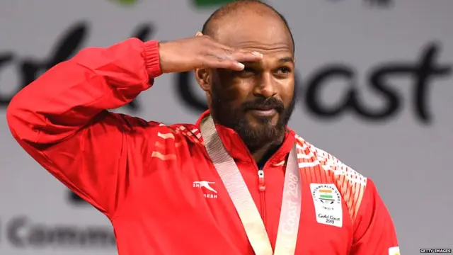 Sathish Kumar Sivalingam of India celebrates winning the gold medal in the men's 77kg weightlifting event at the 2018 Gold Coast Commonwealth Games on April 7, 2018.