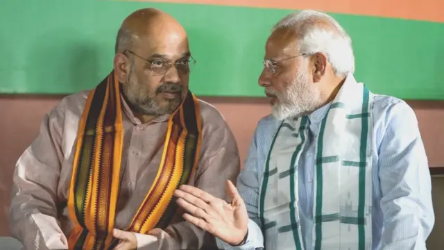 અમિત શાહ તથા મોદીની તસવીર