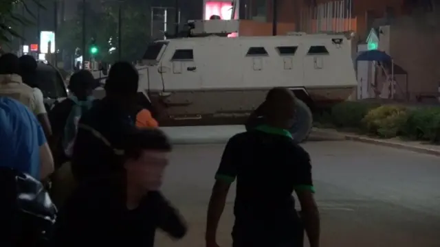An armoured vehicle opens fire in the direction of a restaurant following an attack by gunmen in Ouagadougou, Burkina Faso