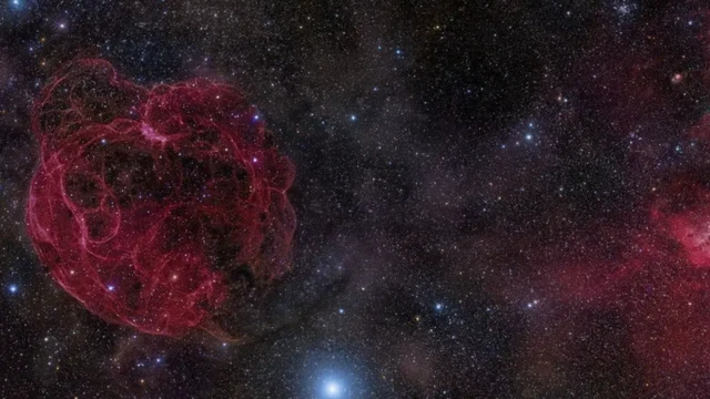 ภาพจำลองกาแล็กซีแคระที่เป็นแหล่งกำเนิดของ FRB 121102 คาดว่าที่มาของสัญญาณอยู่ตรงมุมขวาบนของภาพ