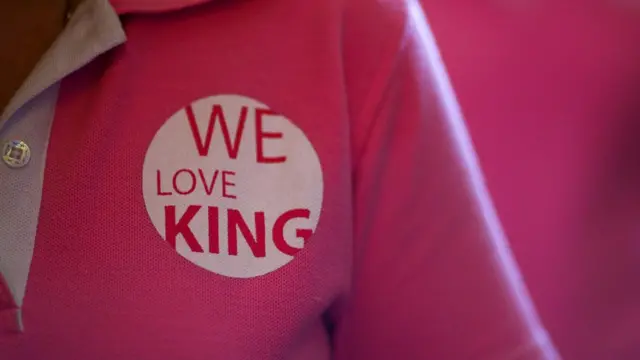 A well-wisher wears a shirt saying 'We love the king' in Bangkok on 13 October 2016