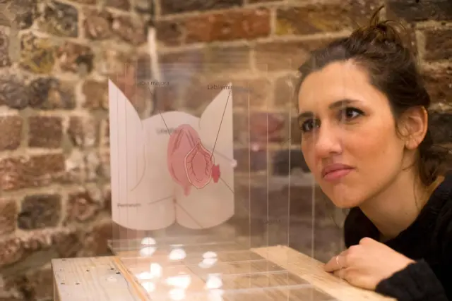 A visitor looks at a display during the press preview of the new Vagina Museum in Camden market,