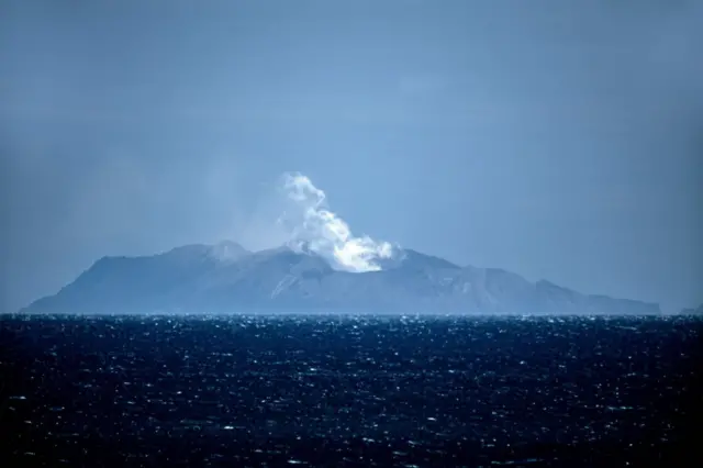 Steam rises from the White Island volcano