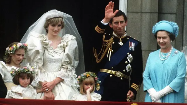 The Prince and Princess of Wales pose on the balcony of Buckingham Palace on their wedding day, with the Queen and some of the bridesmaids, 29th July 1981