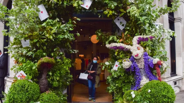 Alice in Wonderland themed flower display is seen in Duke Of York Square