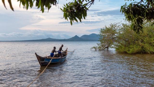 Kenyan boys on a fishing boat on Lake Victoria