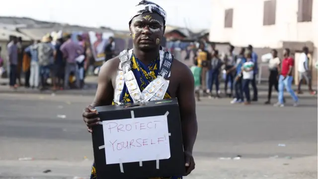 Francis Oko Armah, a youth activist dressed in a unique traditional outfit designed with condoms is raising awareness about the spread of HIV AIDS in Ghana