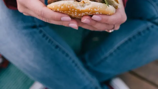 Holding a burger