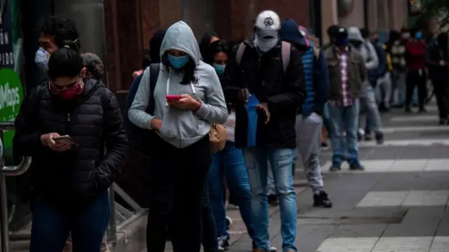 People queuing to collect unemployment benefits in Santiago, Chile, May 2020