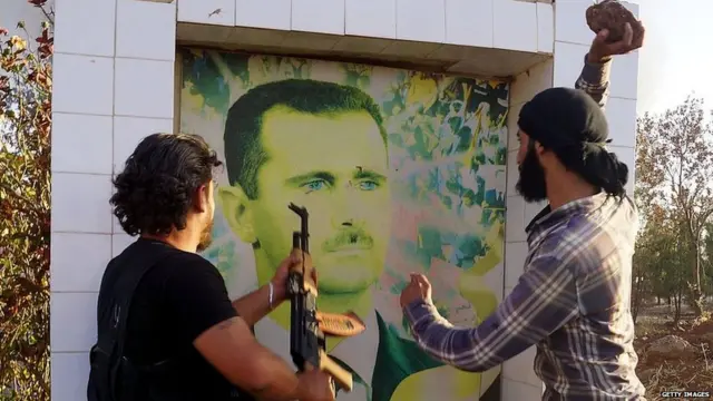 ਸੀਰੀਆ ਦੇ ਵਿਰੋਧੀ ਲੜਾਕਿਆਂ ਨੇ ਅਸਦ ਦੀ ਤਸਵੀਰ ਨੂੰ ਨੁਕਸਾਨ ਪਹੁੰਚਾਇਆ (ਫਾਈਲ ਫੋਟੋ)