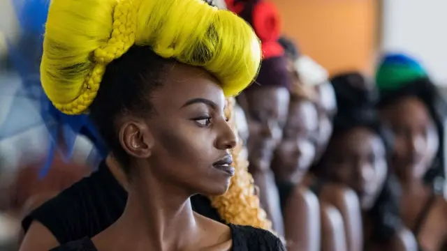 Model Winfrida Metili, from Dar es Salaam, presents a creation during the opening night of the Swahili Fashion Week in Dar es Salaam,Tanzania on December 2, 2016
