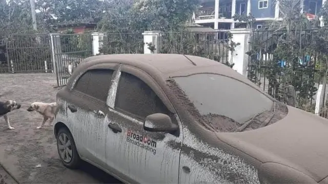 A car covered in ash