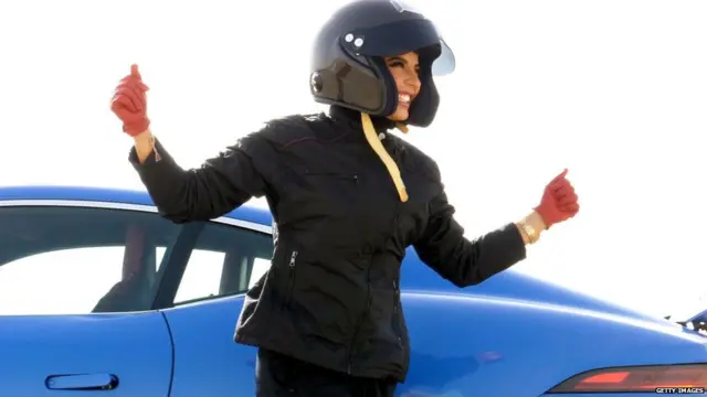 Saudi female racing driver, Aseel Al Hamad celebrates completing her lap of honour in a Jaguar F-TYPE as she races for the first time in her home country, to commemorate the ban for women driving being lifted, on June 21, 2018 in Riyadh, Saudi Arabia.
