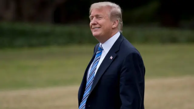US President Donald Trump walks to Marine One prior to departure from the South Lawn of the White House in Washington, DC, February 16, 2018, as he travels to Florida for the weekend