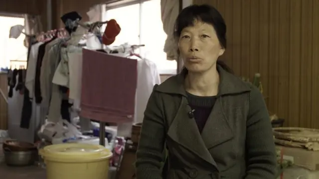 Zhang, una costurera china.