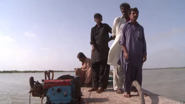 Fishermen on a small boat