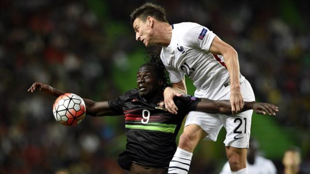 Portugal's forward Eder (L) vies with France's defender Laurent Koscielny during the Euro 2016 friendly football match Portugal vs France at the Jose Alvalade stadium in Lisbon on September 4, 2015.