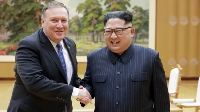 North Korean leader Kim Jong Un shakes hands with U.S. Secretary of State Mike Pompeo in this May 9, 2018