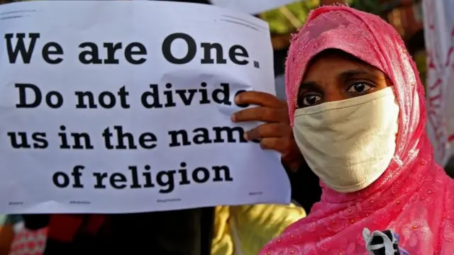 People from different human rights organizations hold placards during a protest against BJP-lead government and Chief Minister of Uttar Pradesh Yogi Adithyanath over the so-called "love Jihad" law, in Bangalore, India, 01 December 2020